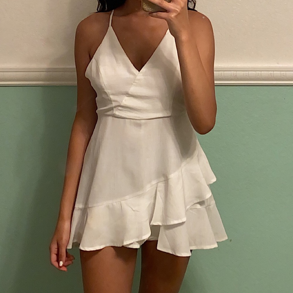 White romper with ruffles, open back